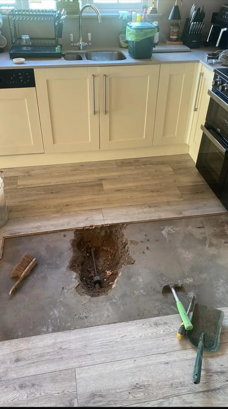 Kitchen floor opened up at the marked leak location